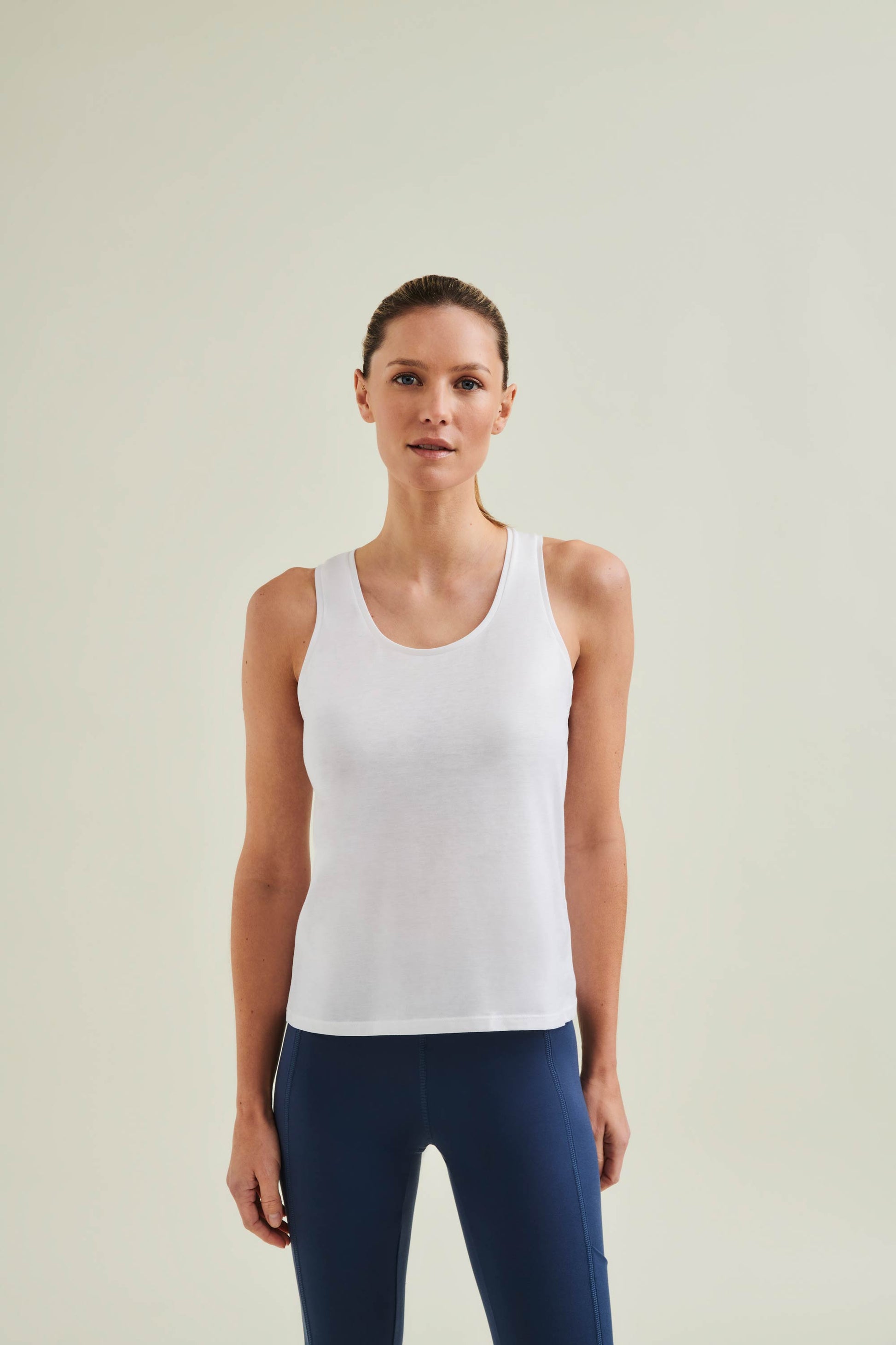 Ethical workout tank in Diamond White crafted from GOTS-certified organic cotton, ensuring comfort during yoga, Pilates and fitness sessions